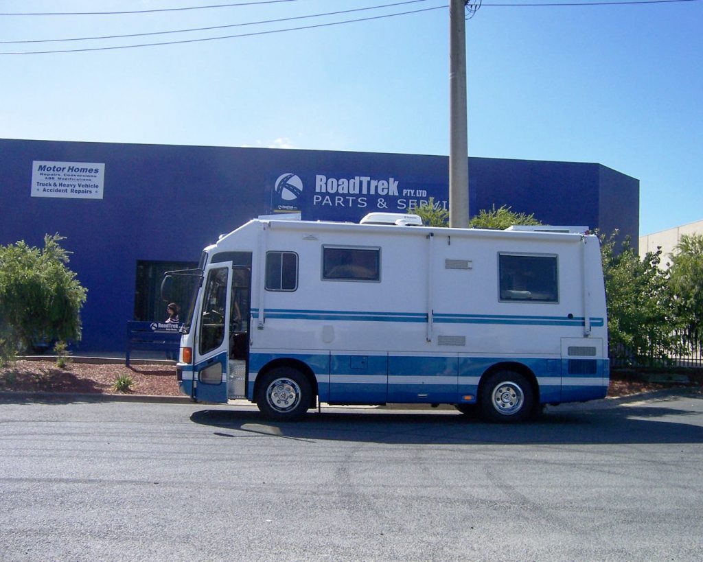 Vintage camper outside Roadtrek