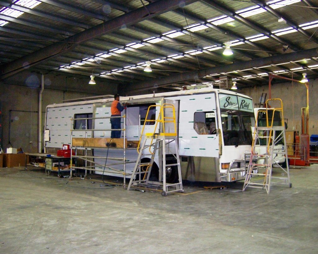 Roadtrek staff working on large motorhome