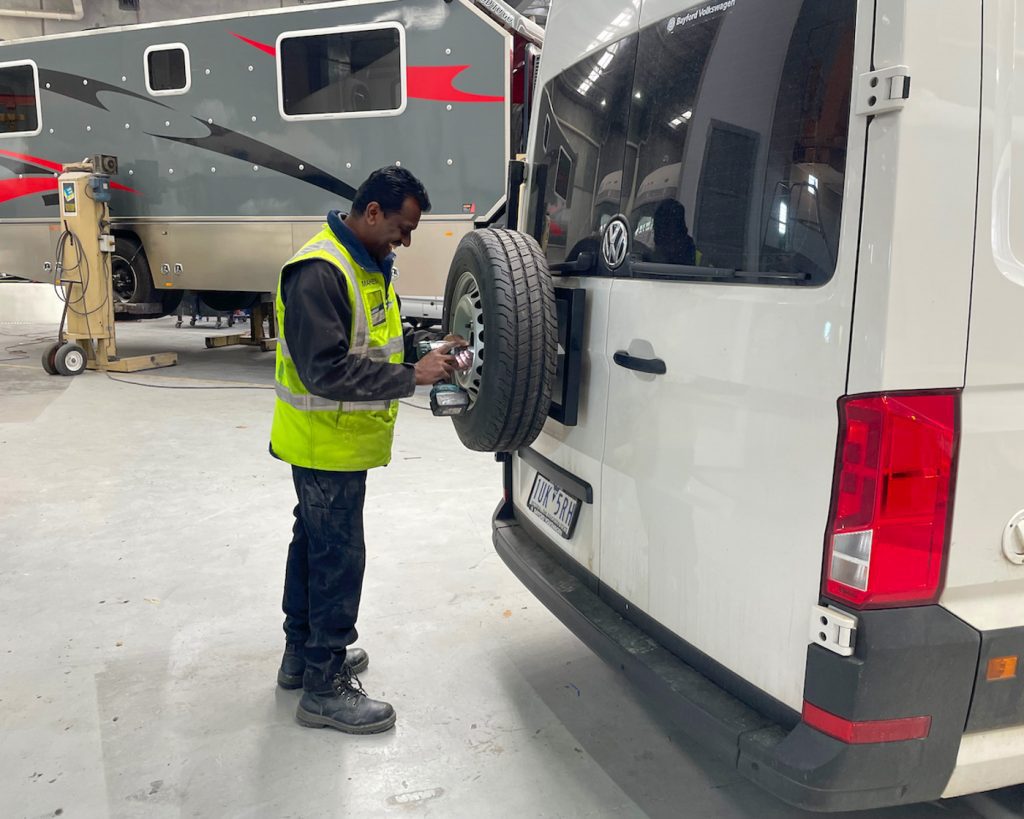 Roadtrek team member working on a motorhome